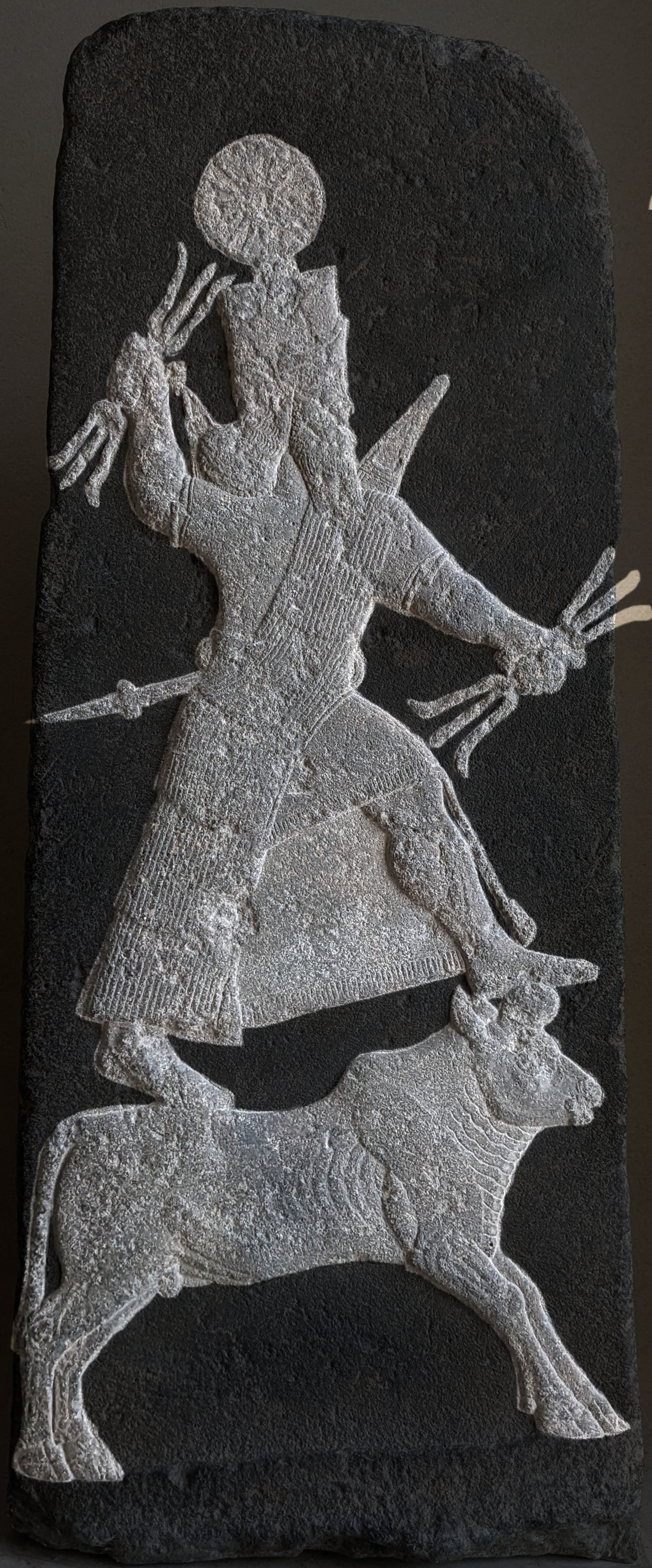 Relief of the Mesopotamian storm-god Ishkur/Adad holding thunderbolts, c. 735 BCE