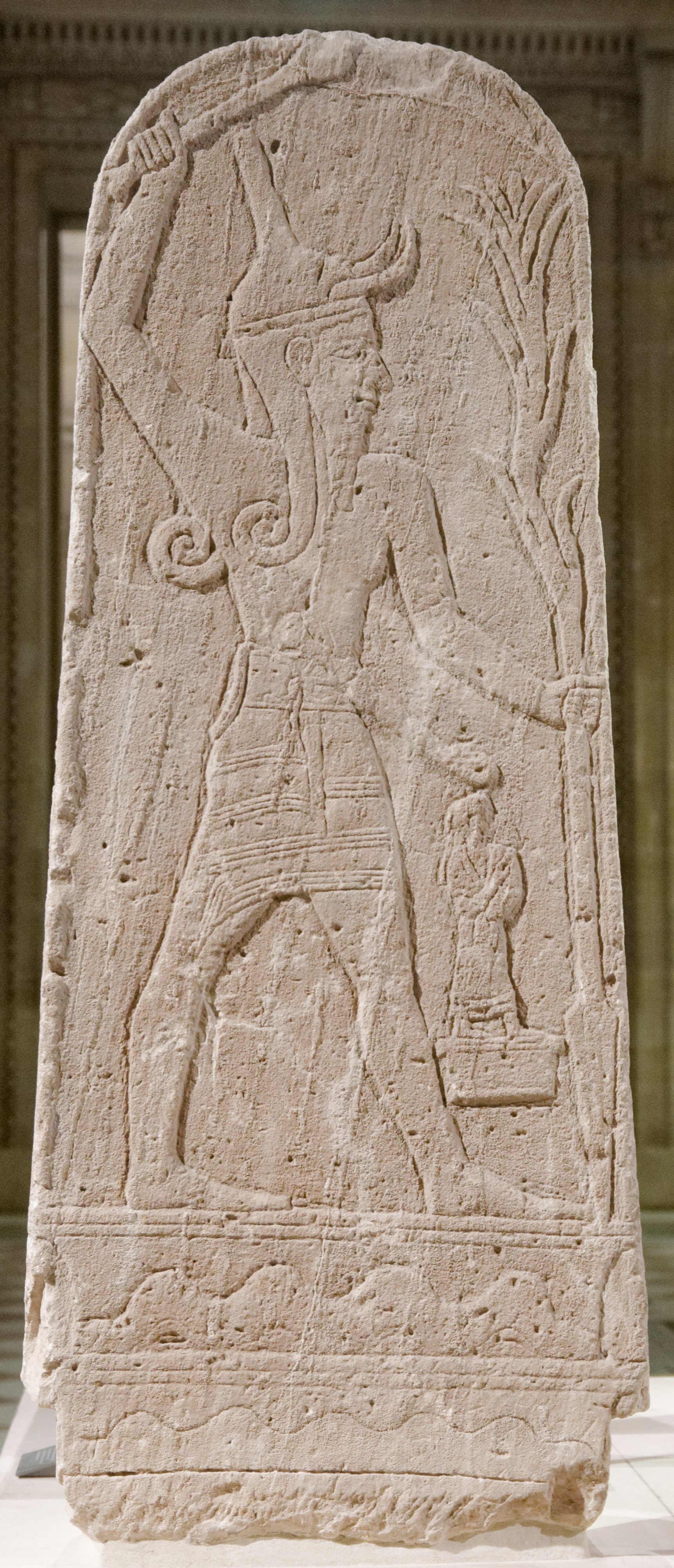 Limestone stele of Baal with a thunderbolt, the storm-god striding with raised arm, from Ugarit, c. 1400–1200 BCE, Louvre Museum