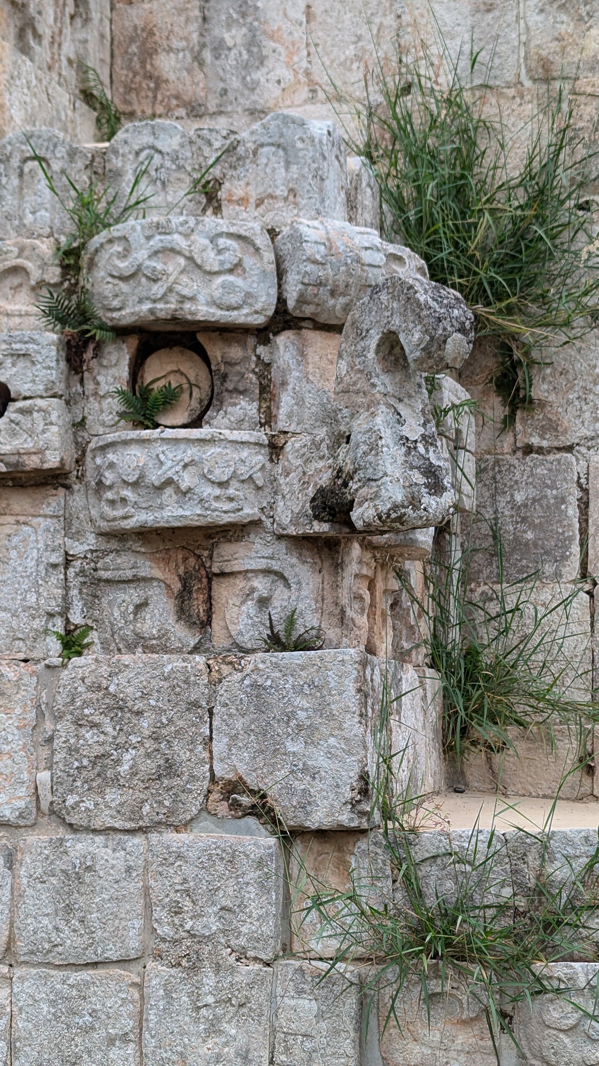 Hook-nosed stone masks of the rain god Chaac on the Pyramid of the Magician, Uxmal, Yucatan