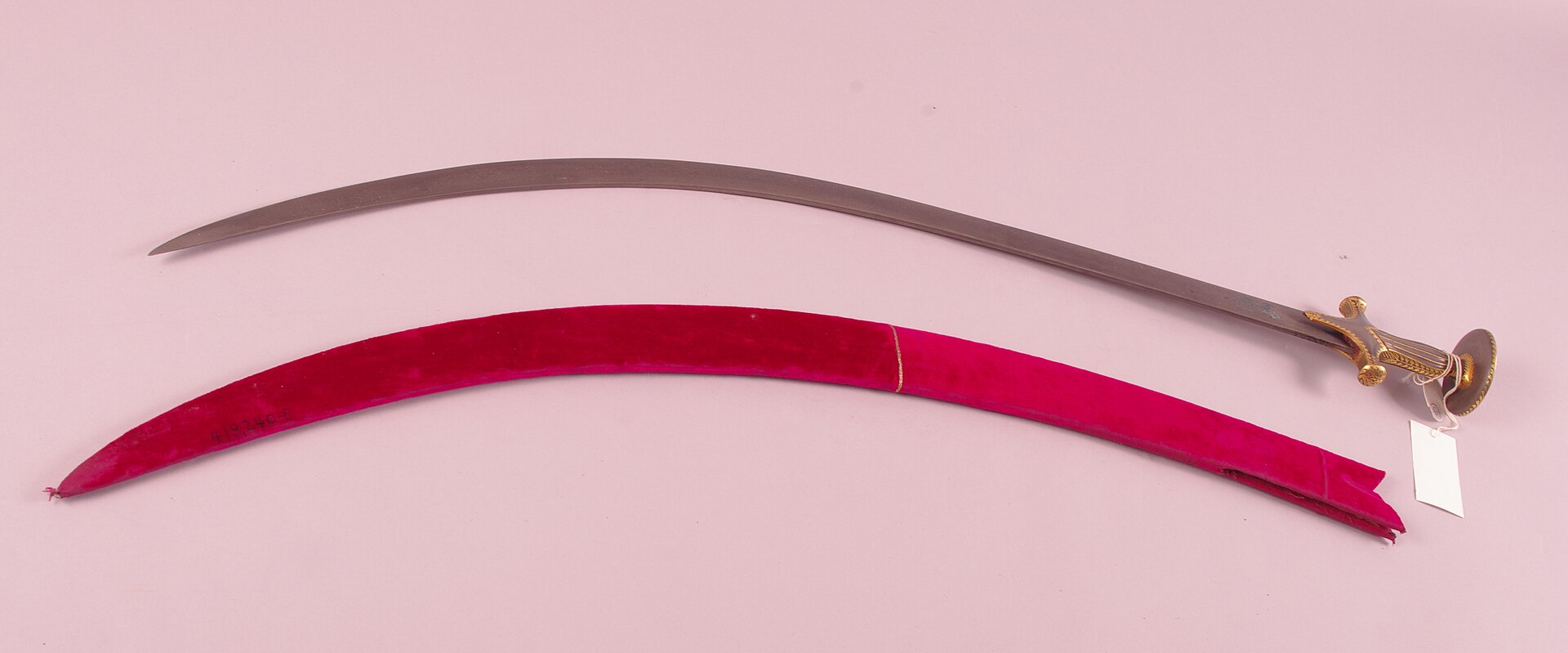 A 17th-18th century Indian tulwar/shamshir with signed Persian wootz steel blade, showing the watered pattern
