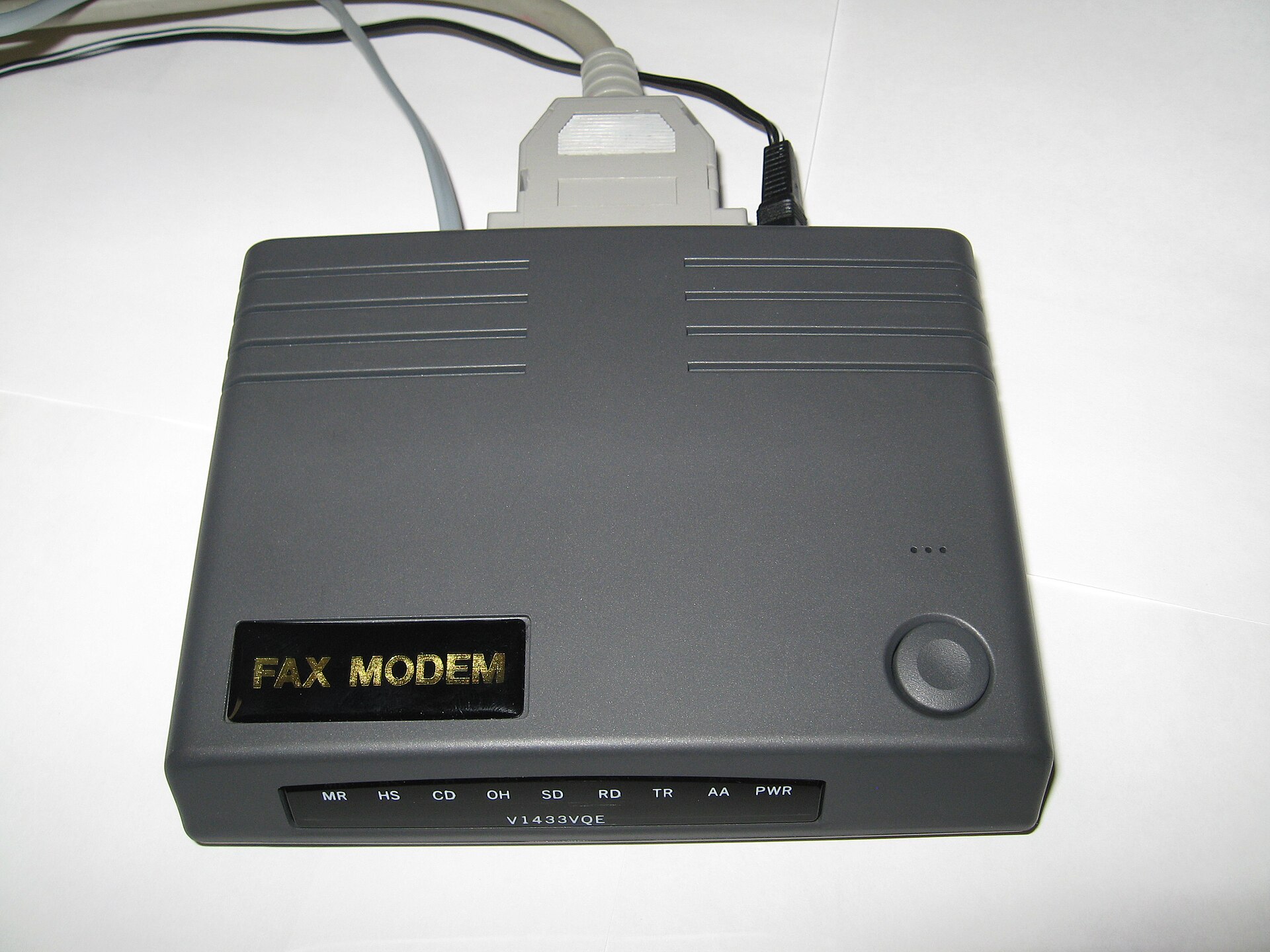 An external 33.6 kbps serial dial-up modem with status indicator lights.