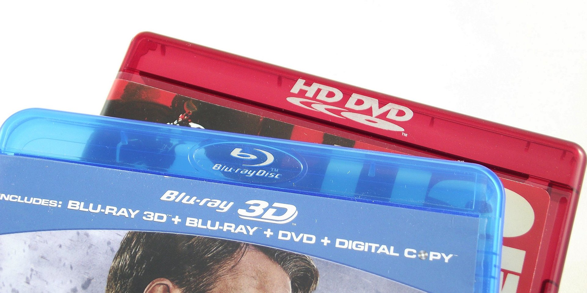 An HD DVD case beside a Blu-ray case, the two rival high-definition optical disc formats side by side.
