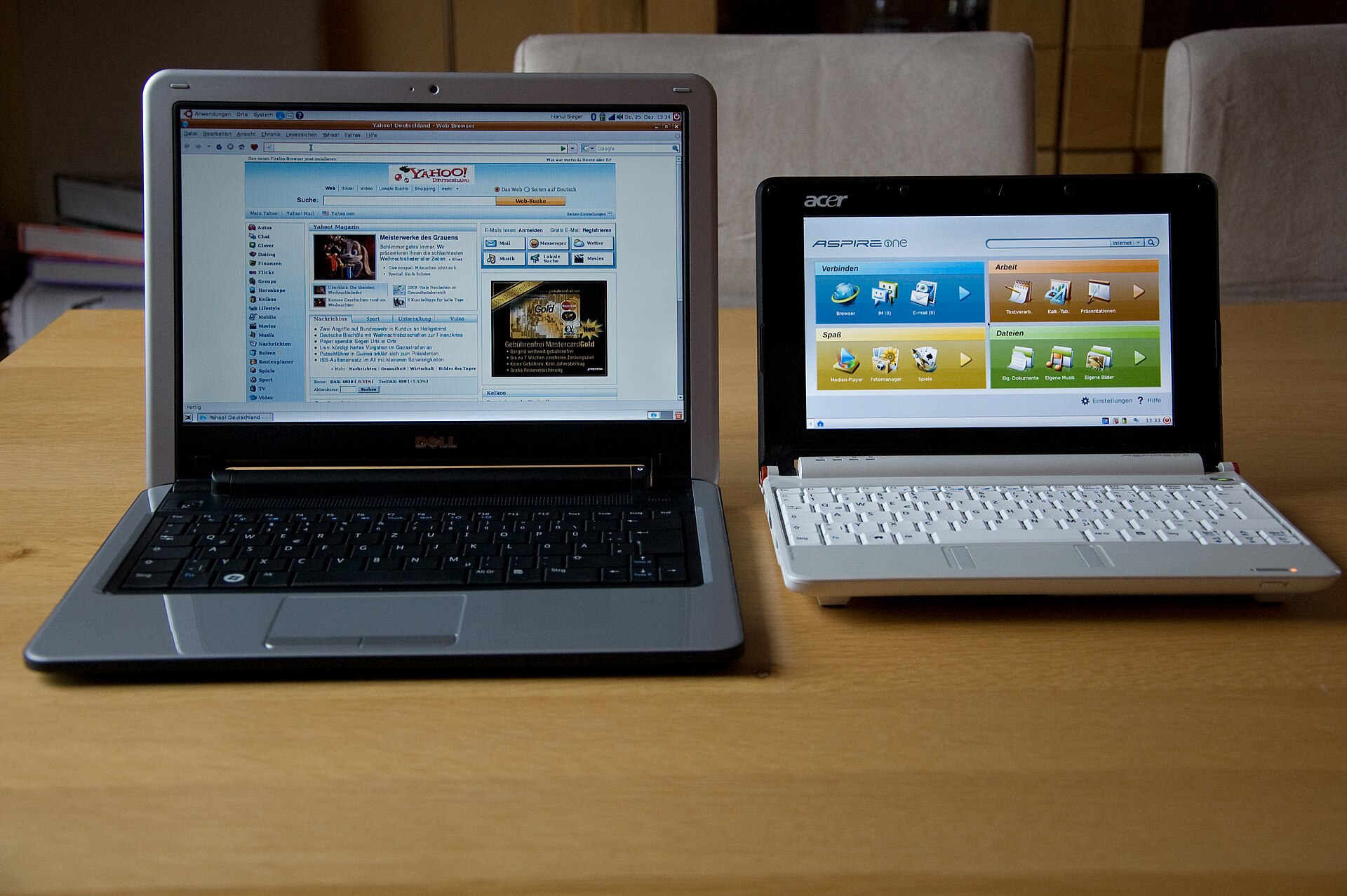A Dell Mini 12 netbook beside an Acer Aspire One, showing the small size of the netbook class