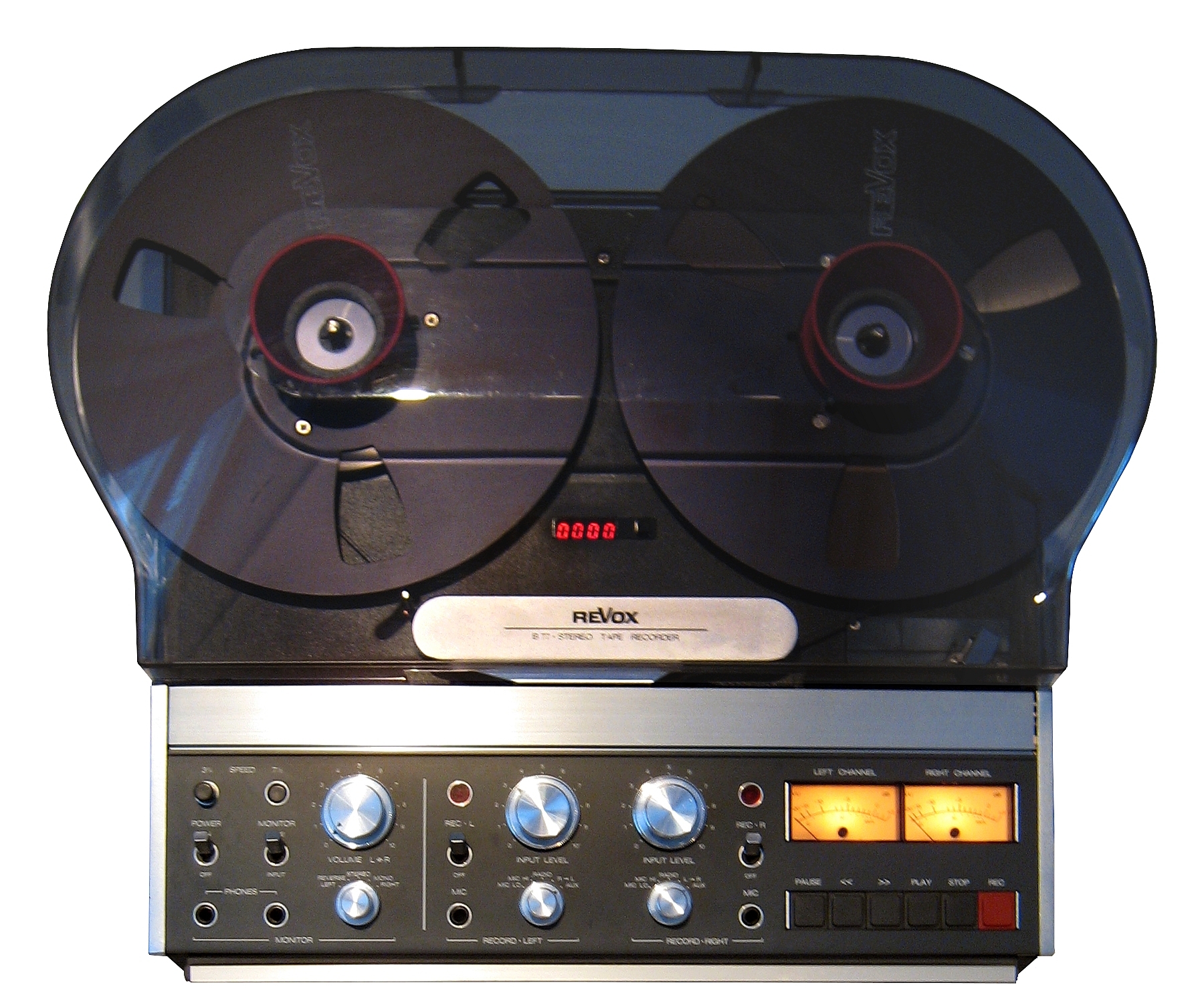 A Revox B77 open-reel tape recorder with two tape reels mounted on the deck.