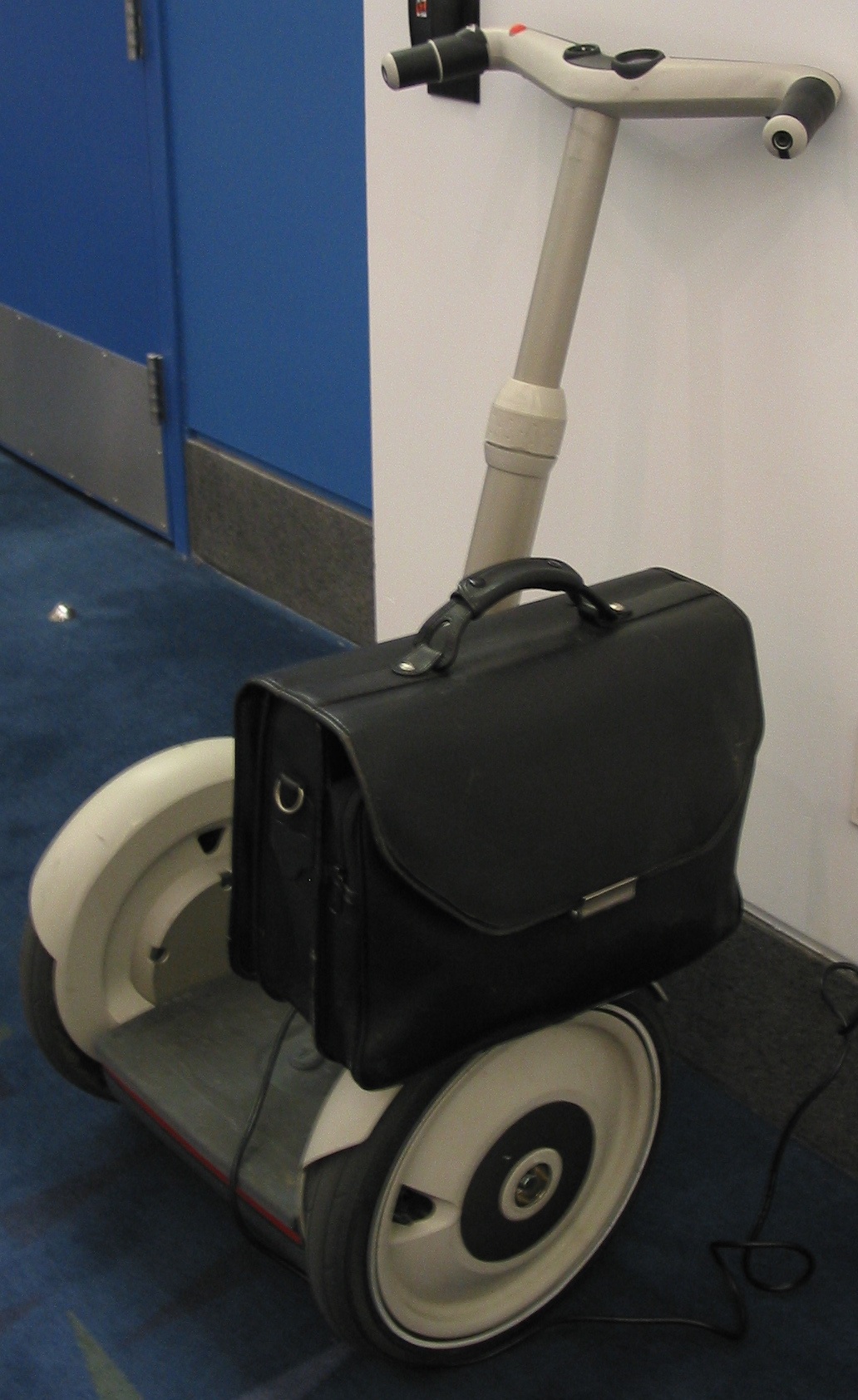 A single Segway PT parked and charging at Segway Fest in Chicago