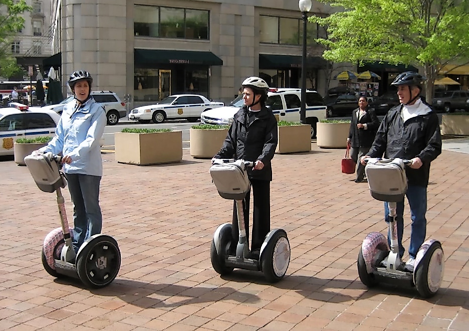 Riders on Segway PT two-wheeled personal transporters in Washington, D.C.