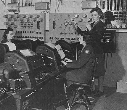 Operators working teletype (telex) machines, a U.S. Army photograph from World War II.