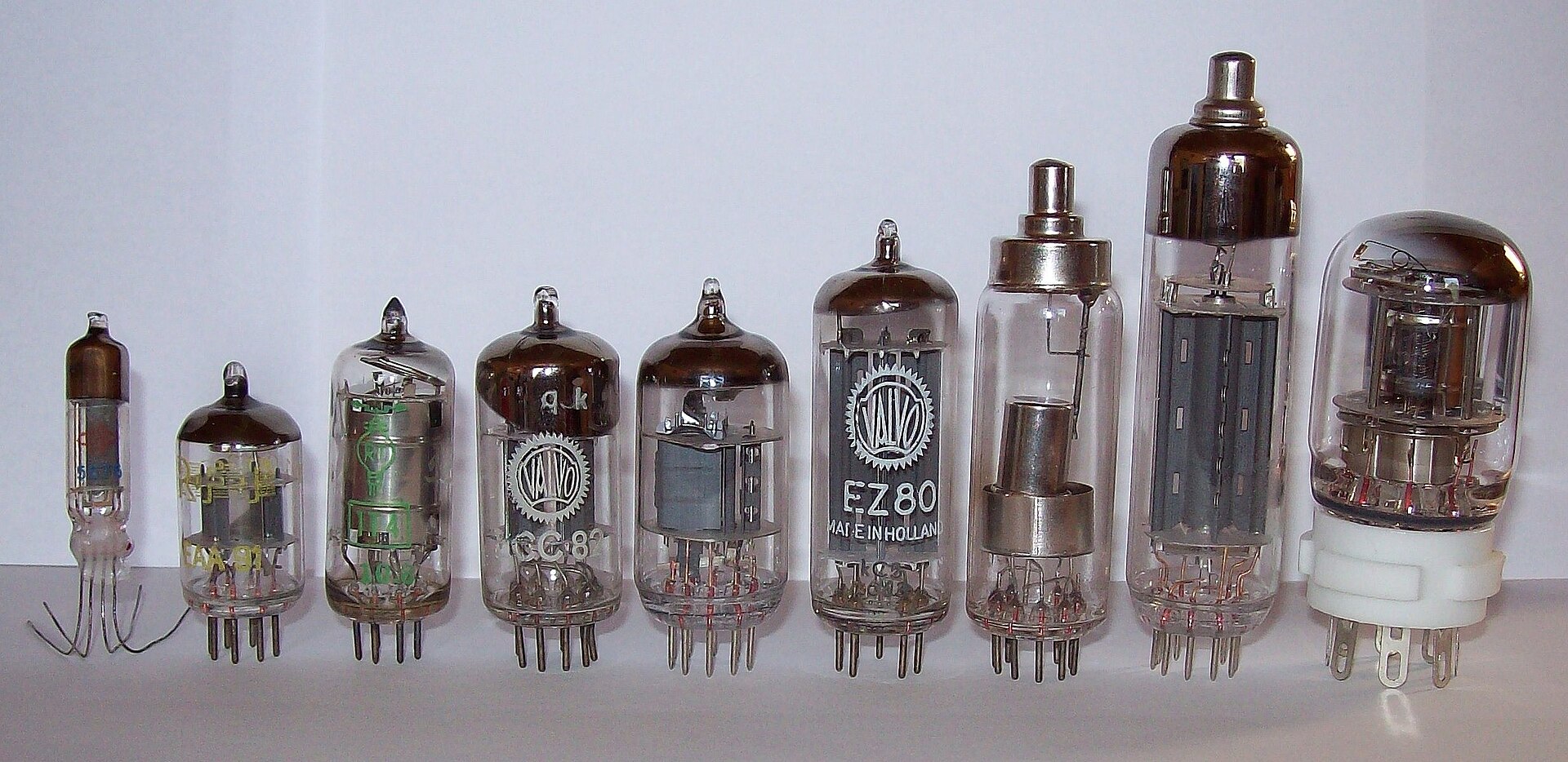 An assortment of vacuum tubes (thermionic valves) of various sizes.