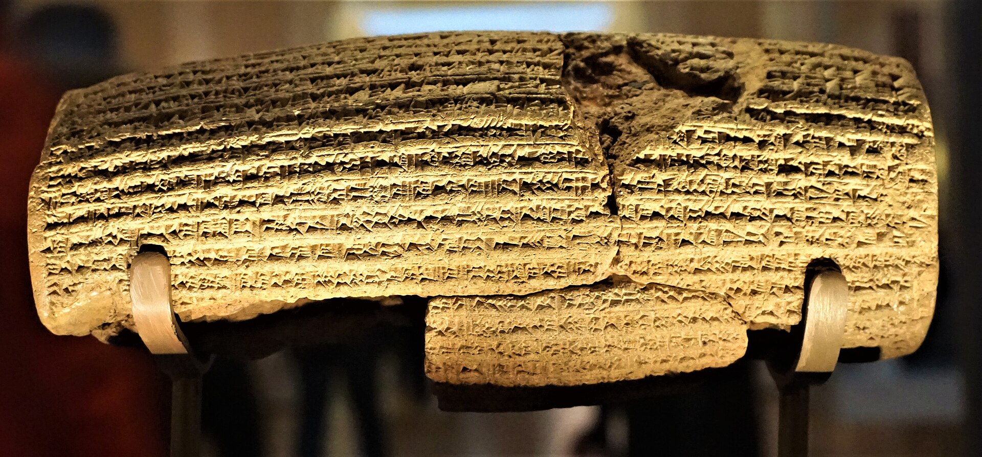 The Cyrus Cylinder, a clay barrel inscribed in Akkadian cuneiform, in the British Museum