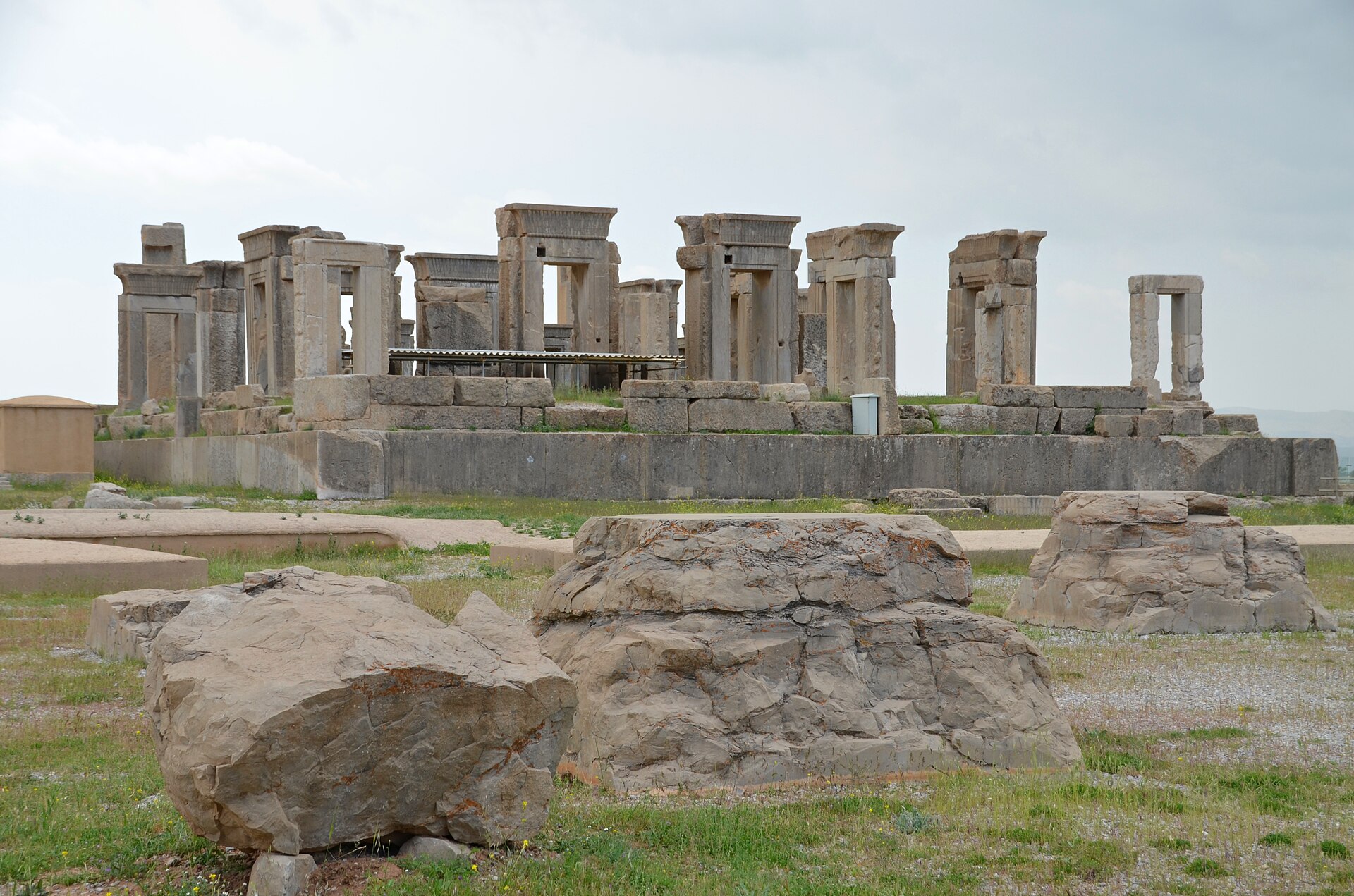 Ruined columns and carved doorways of the Tachara, the Palace of Darius, at Persepolis